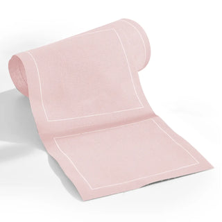 Pink towel with white trim on a white background