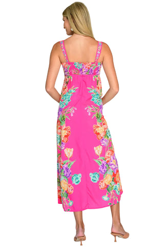 Woman wearing a pink floral dress on a white background