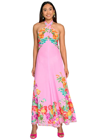 Woman wearing a pink floral dress against a white background