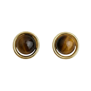 A pair of gold-toned stud earrings with round brown tiger's eye cabochons, set against a plain white background.