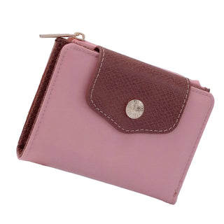 Pink wallet with brown flap on a white surface